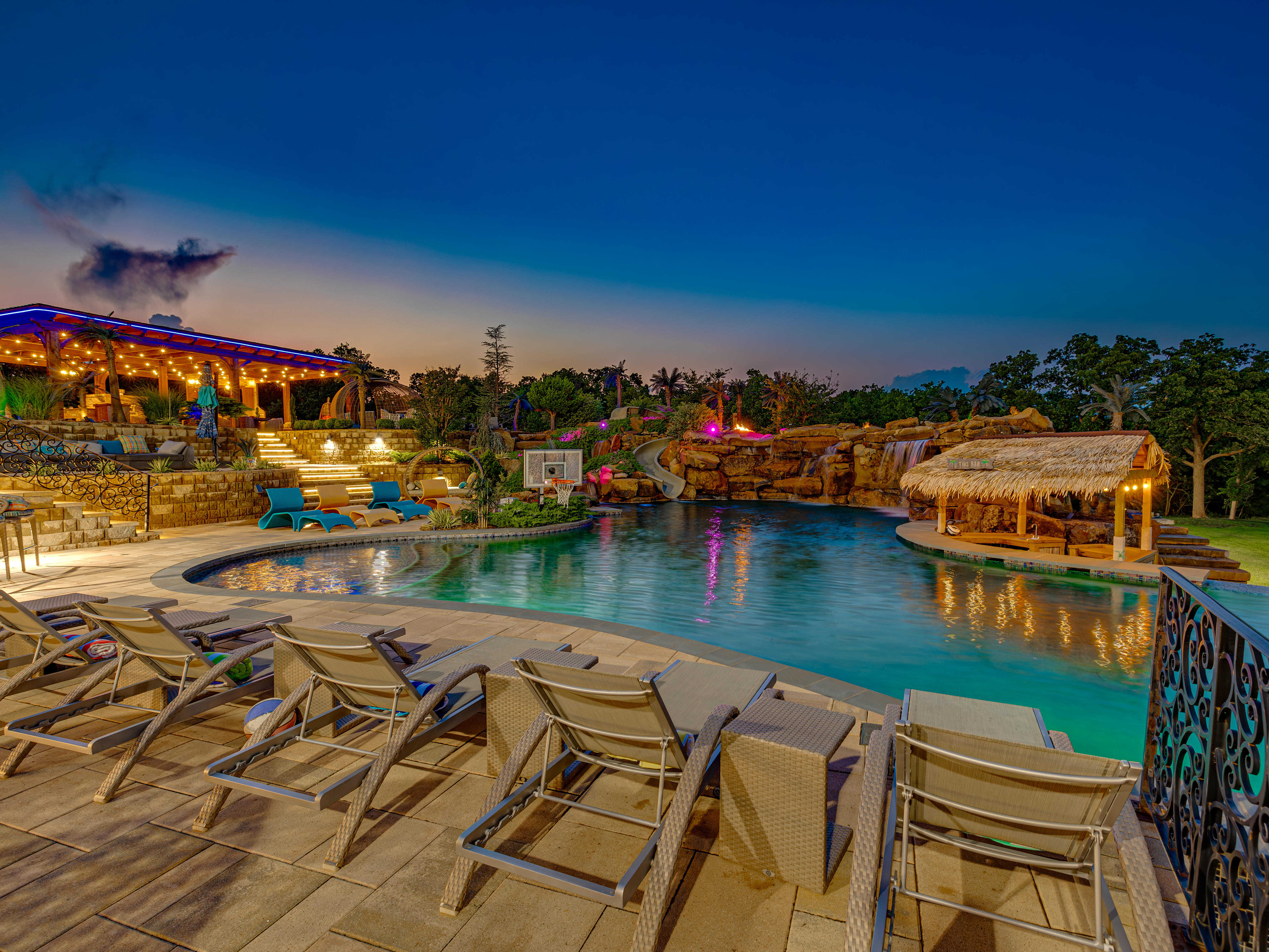 Resort pool at twilight with palapa bar — wedding receptions at 36 Acres