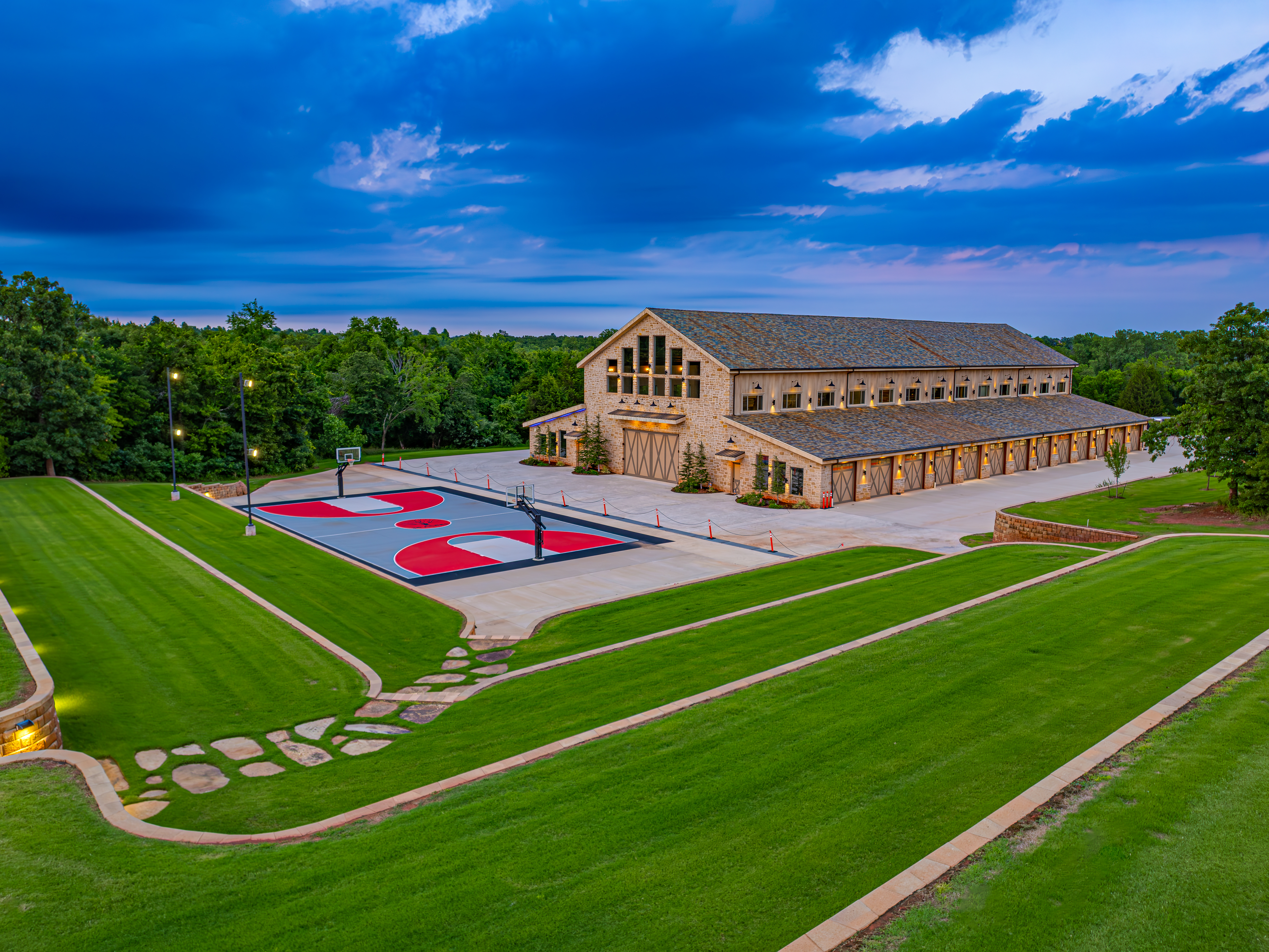 Aerial of the barn and private court — every angle is frame-worthy at 36 Acres