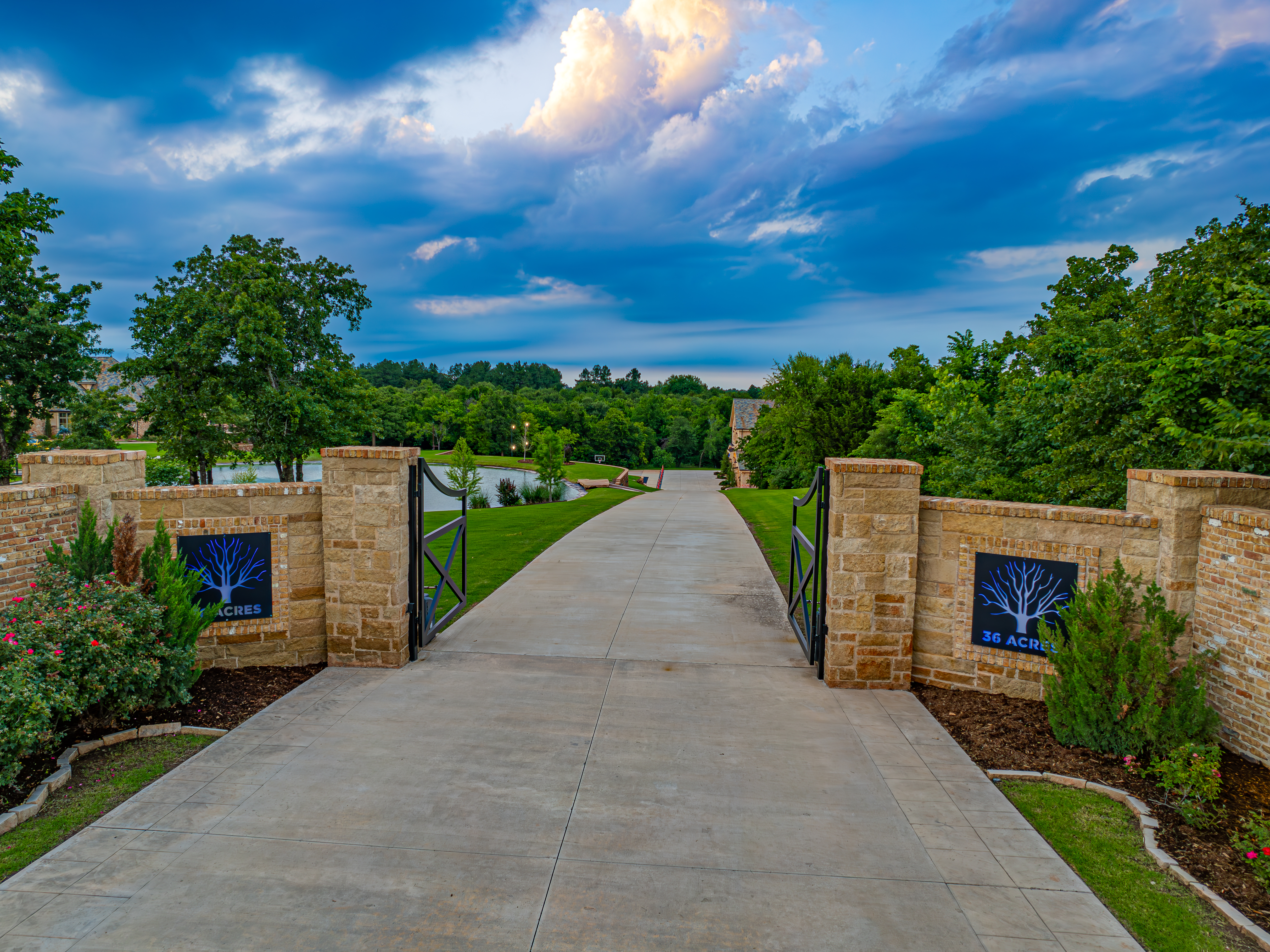 36 Acres entrance — stone pillars and gated driveway